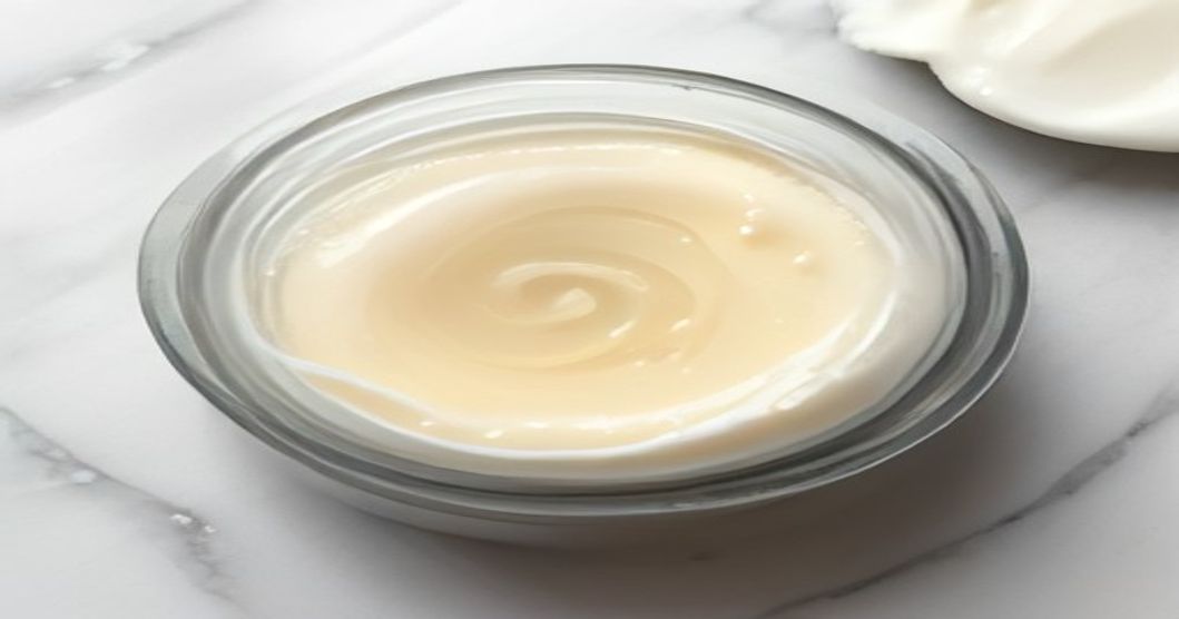 Best moisturizer for irritated skin after tretinoin showing ceramide-rich formula in soft pastel tones